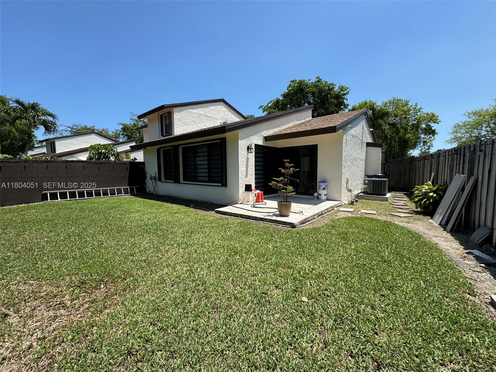 12721 Southwest 68th Terrace Miami, FL 33183 - Photo 10 of 31 a view of swimming pool with outdoor seating and house in the background