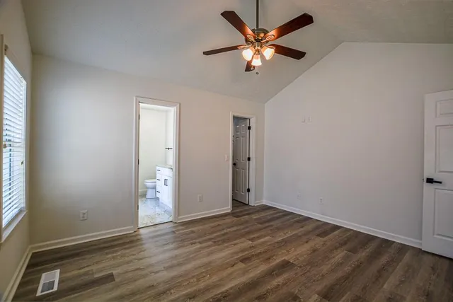 a view of a room with rack on the wall and a window