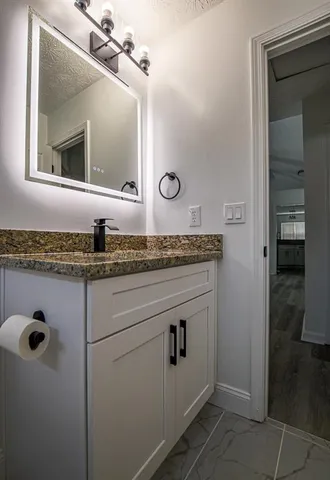 a view of room with window and wooden floor