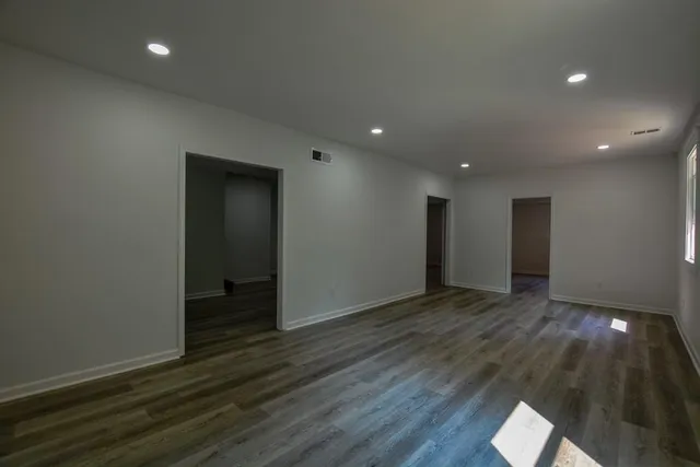 a bathroom with a bathtub and a toilet