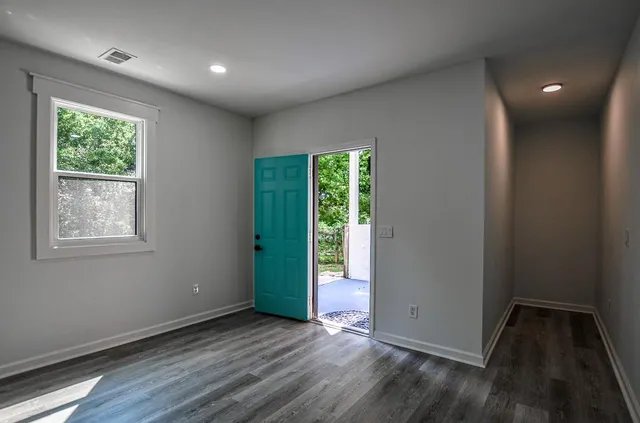 a view of a porch with furniture and yard
