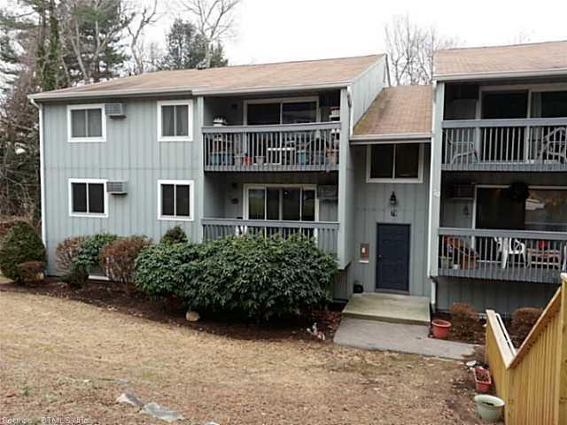 70 Buddington Road, Unit 7 Groton, CT 06340 - Photo 1 of 1 a front view of a house with garden