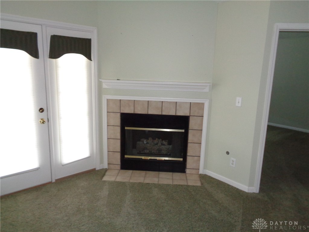 80 Villa Pointe Drive Springboro, OH 45066 - Photo 6 of 19 This cozy living space features a charming fireplace, perfect for relaxation.