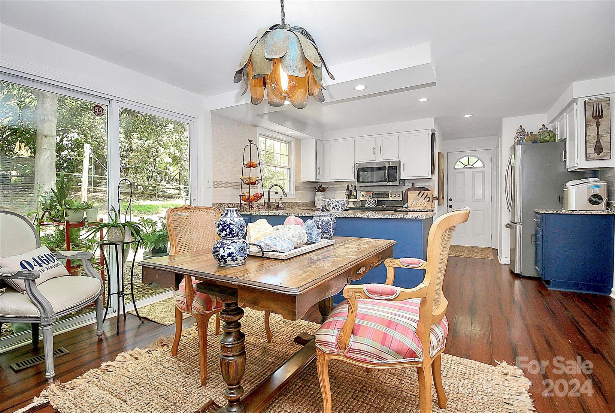 6225 Pella Road Charlotte, NC 28211 - Photo 4 of 7 a view of a dining room with furniture window and wooden floor
