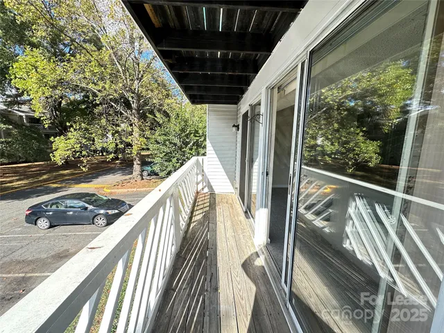 a kitchen with a stove and a shower