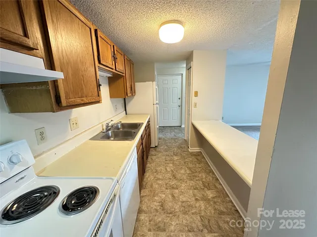 a bathroom with a sink a washer and dryer