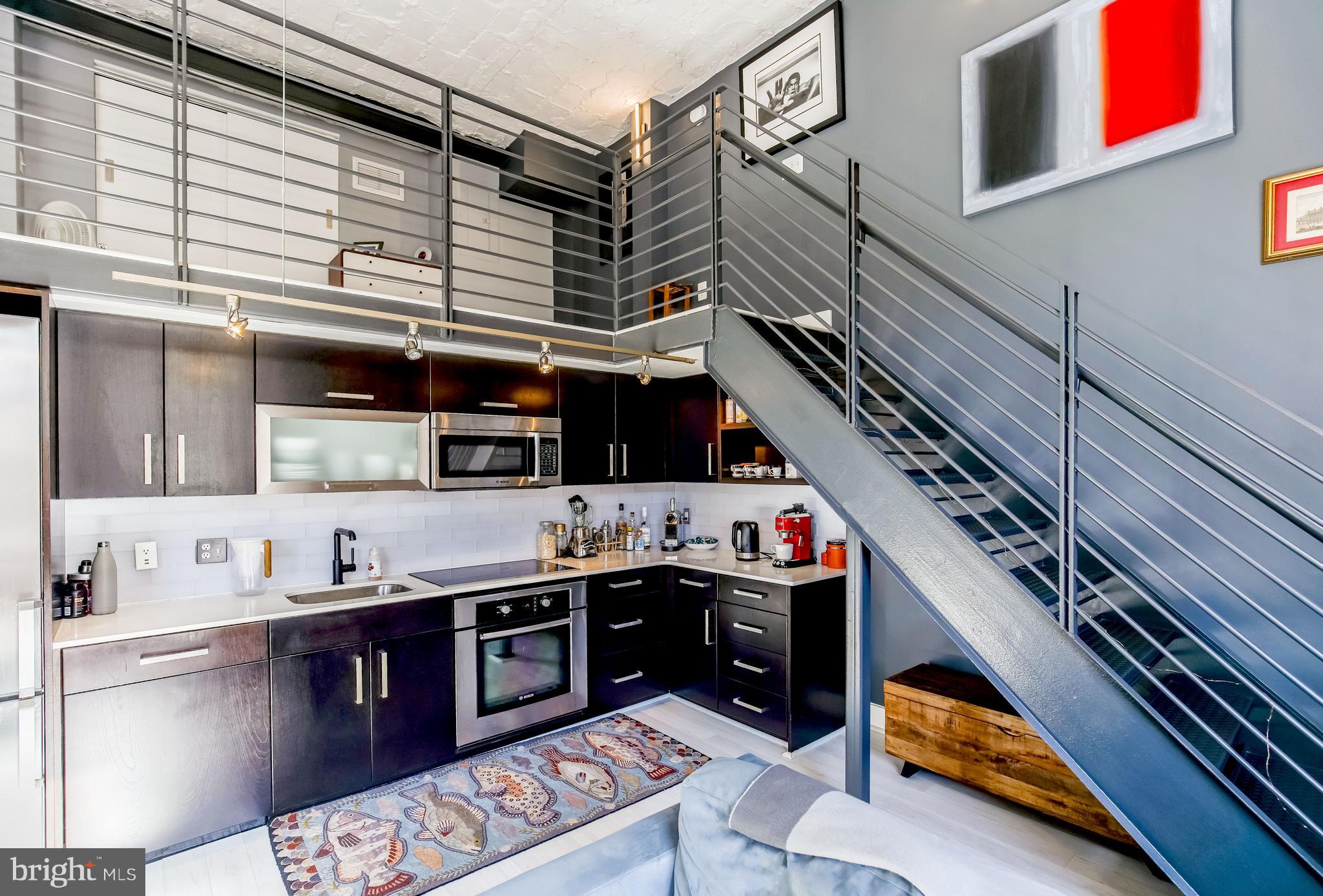 1401 R Street Northwest, Unit 303 Washington, DC 20009 - Photo 11 of 28 The kitchen and the stairway