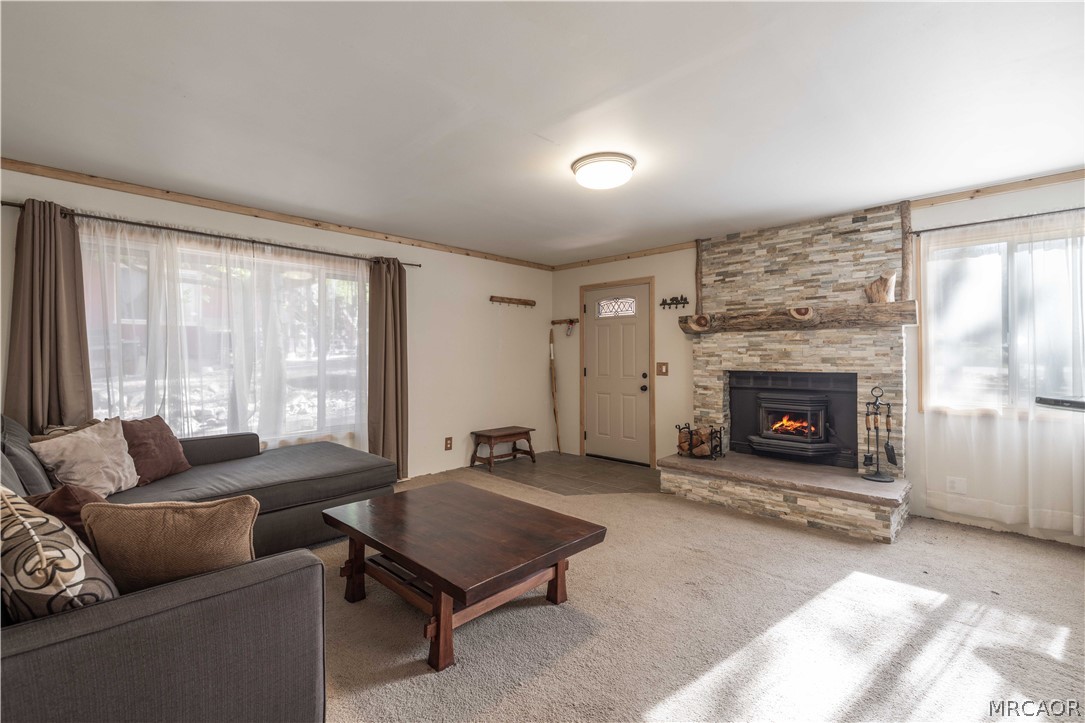 773 Sunset Lane Sugarloaf, CA 92386 - Photo 3 of 33 a living room with furniture and a fireplace