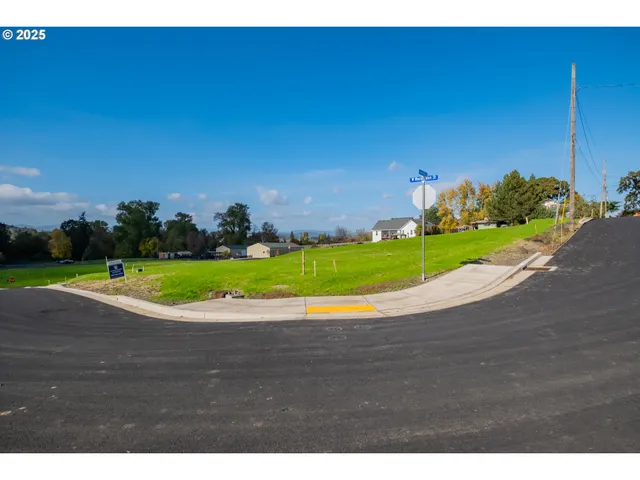a view of a big yard with a house