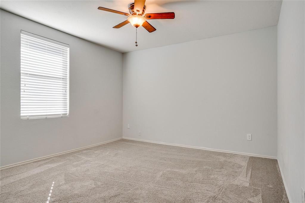 3054 Fallbrook Drive Rockwall, TX 75032 - Photo 11 of 15 an empty room with a window and a fan