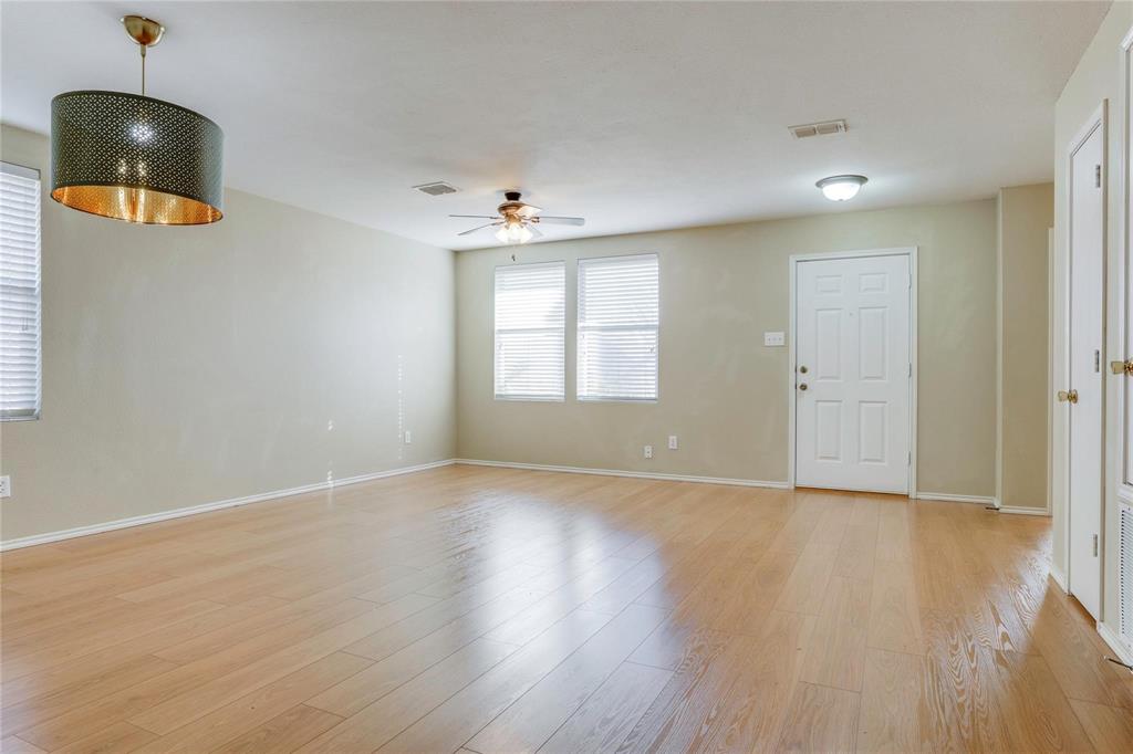 3054 Fallbrook Drive Rockwall, TX 75032 - Photo 2 of 15 an empty room with wooden floor and windows