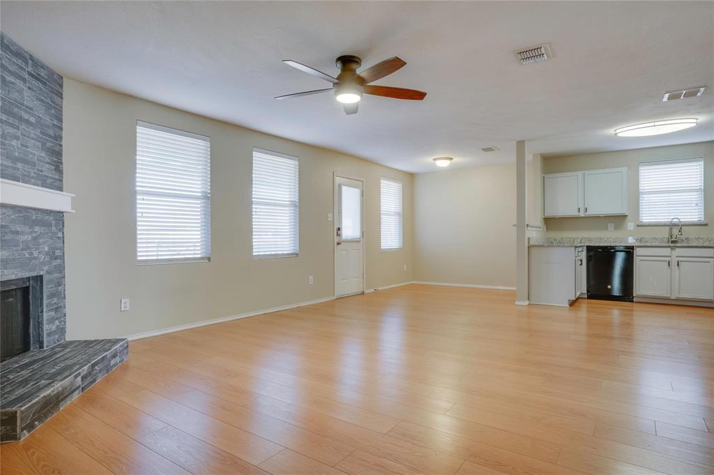 3054 Fallbrook Drive Rockwall, TX 75032 - Photo 5 of 15 a view of an empty room with a fireplace and a window