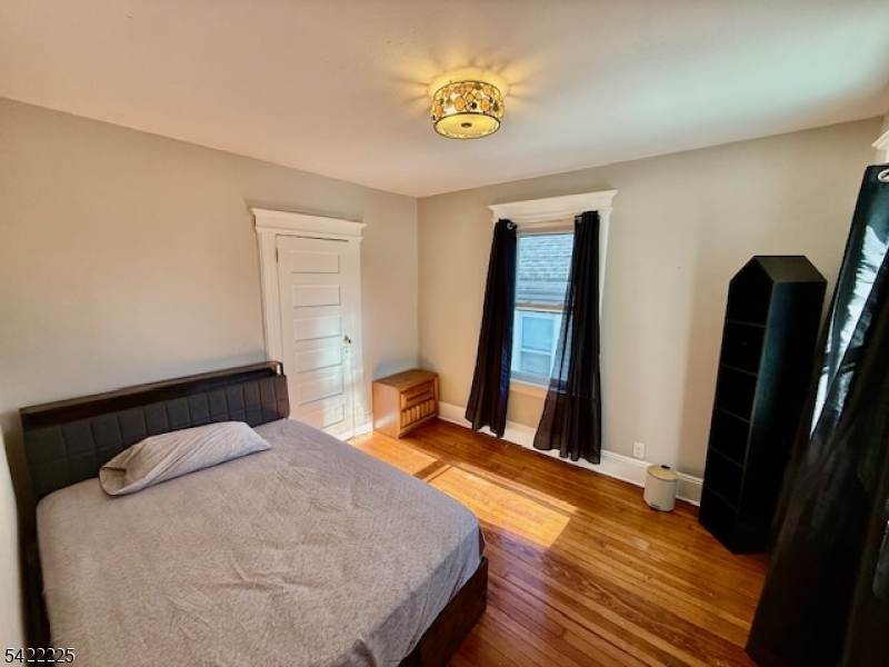 33 Ella Street Bloomfield, NJ 07003 - Photo 13 of 19 a bedroom with a bed and a window