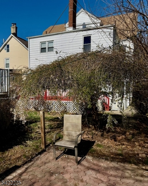 33 Ella Street Bloomfield, NJ 07003 - Photo 18 of 19 a view of a chairs and table in backyard