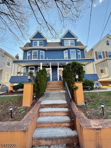 33 Ella Street Bloomfield, NJ 07003 - Photo 2 of 19 a front view of a house with a yard