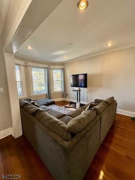 33 Ella Street Bloomfield, NJ 07003 - Photo 5 of 19 a living room with furniture and a flat screen tv