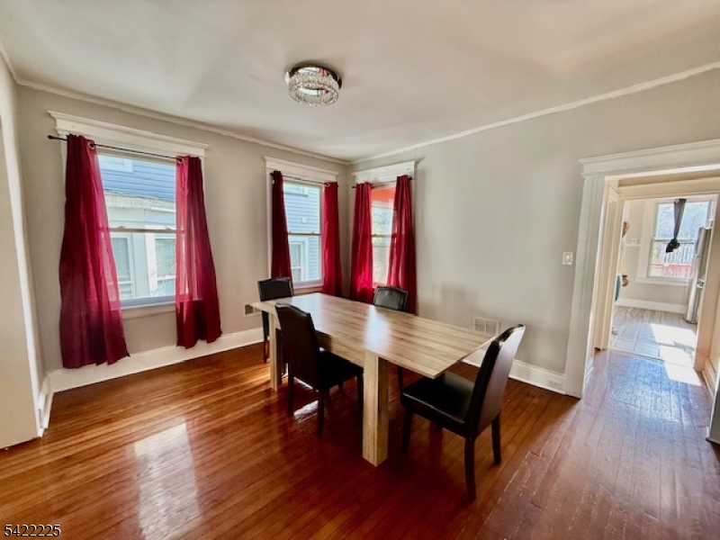 33 Ella Street Bloomfield, NJ 07003 - Photo 8 of 19 a view of a dining room with furniture and wooden floor