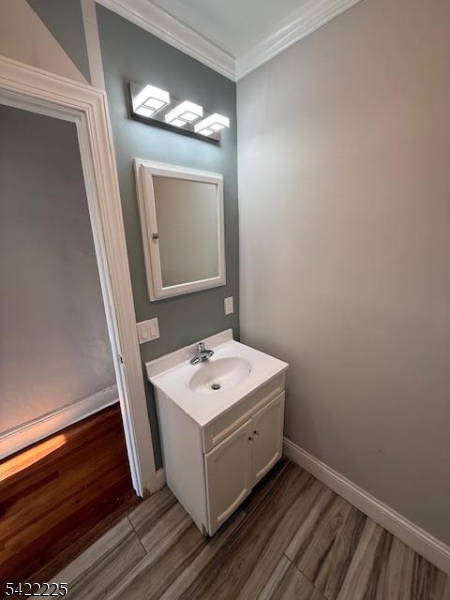 33 Ella Street Bloomfield, NJ 07003 - Photo 9 of 19 a bathroom with a sink mirror and vanity