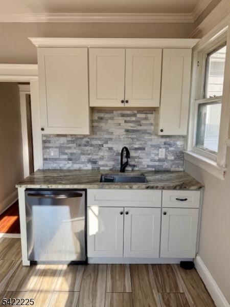 33 Ella Street Bloomfield, NJ 07003 - Photo 10 of 19 a kitchen with stainless steel appliances granite countertop a sink stove and cabinets