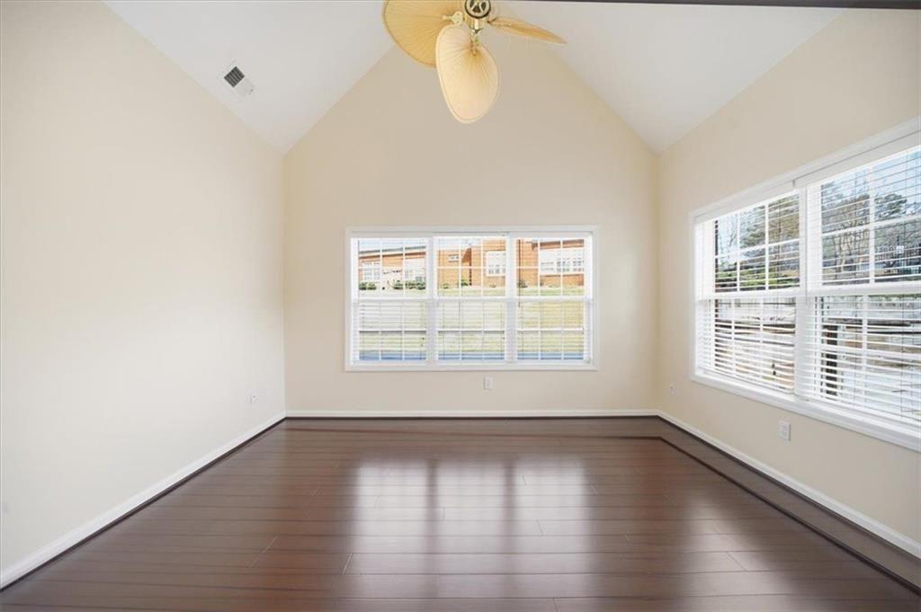 111 Stonegate Lane Canton, GA 30114 - Photo 10 of 30 an empty room with wooden floor and windows
