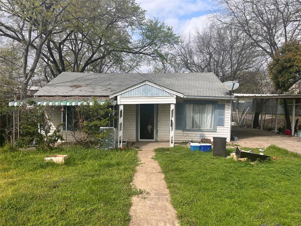 1823 Pollard Street Dallas, TX 75208 - Photo 1 of 1 a front view of a house with a garden and patio