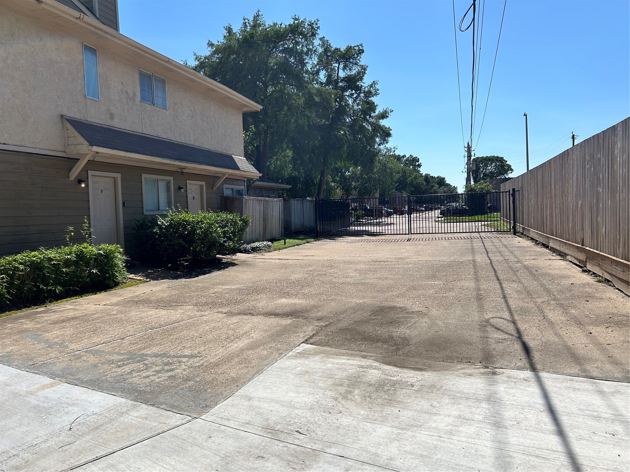 8030 Sands Point Drive, Unit D Houston, TX 77036 - Photo 13 of 14 a view of a house with a backyard