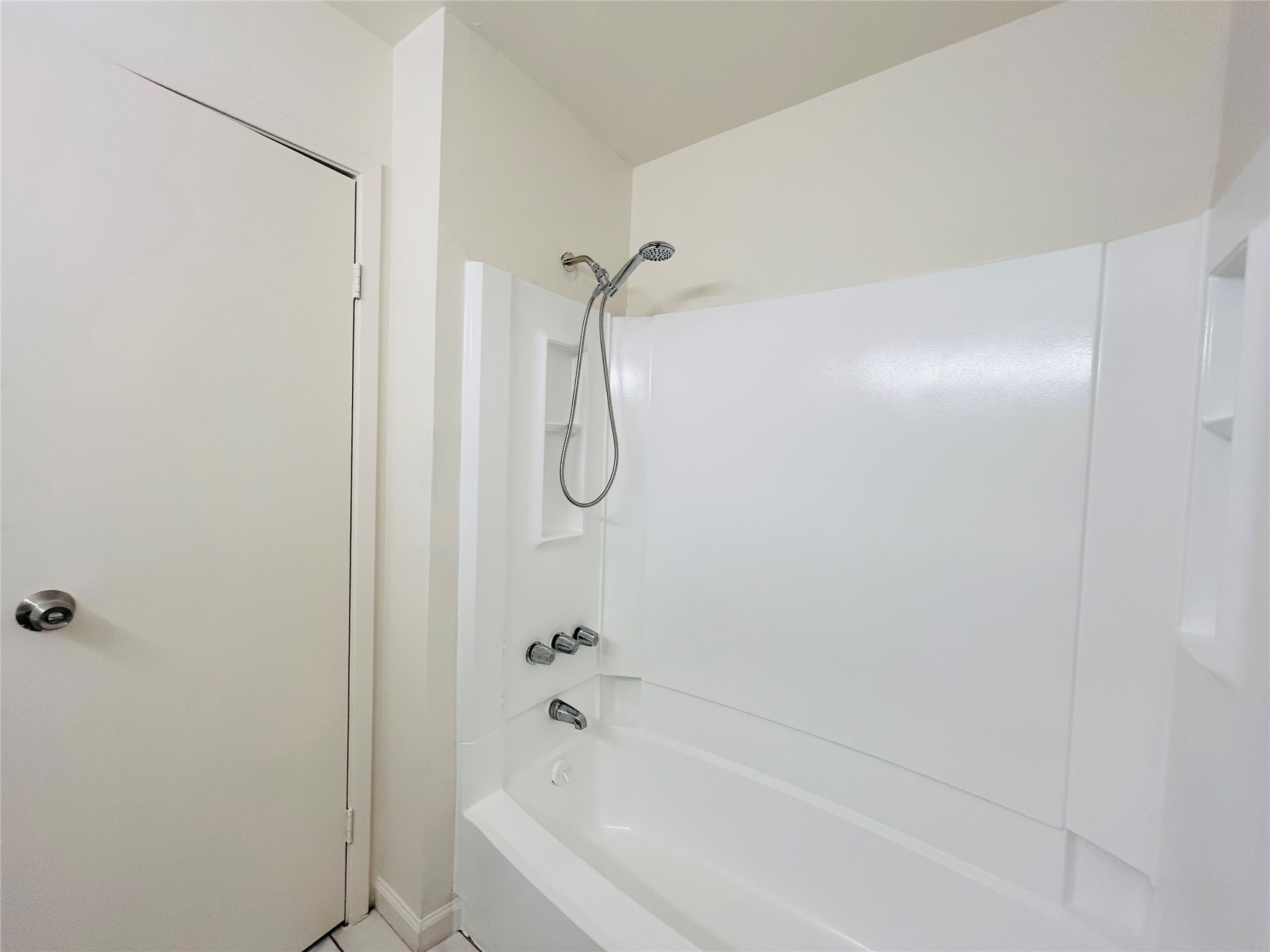 8030 Sands Point Drive, Unit D Houston, TX 77036 - Photo 14 of 24 a bathroom with a bath tub with a shower