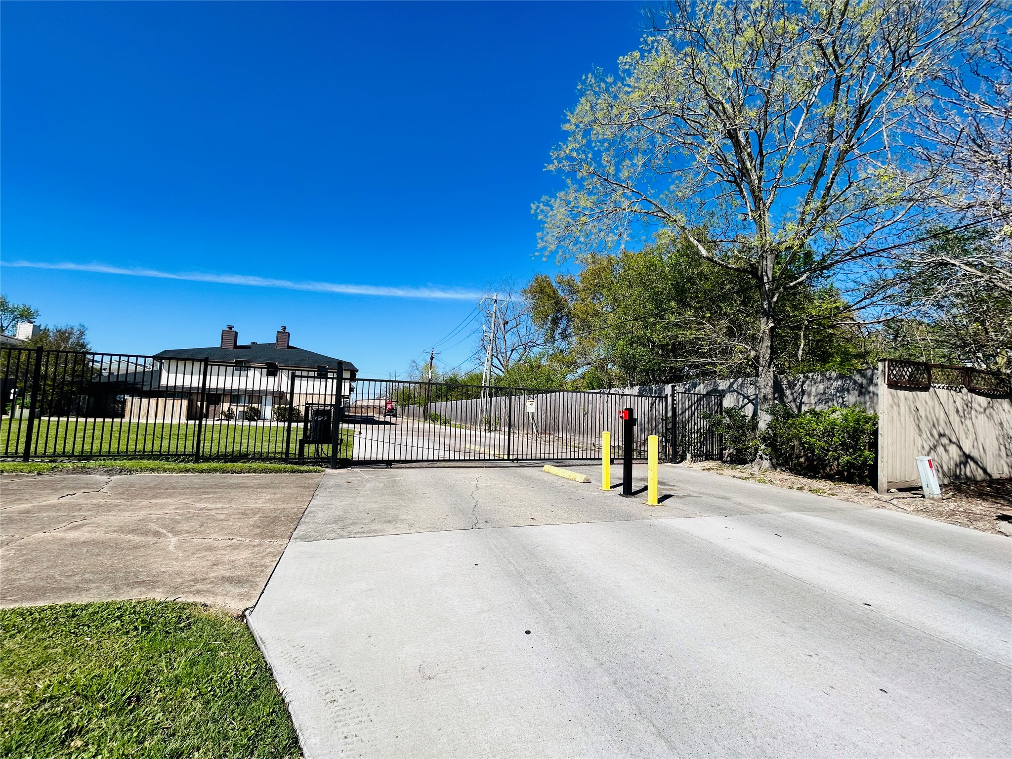 8030 Sands Point Drive, Unit D Houston, TX 77036 - Photo 21 of 24 a park view with a bench in front of house