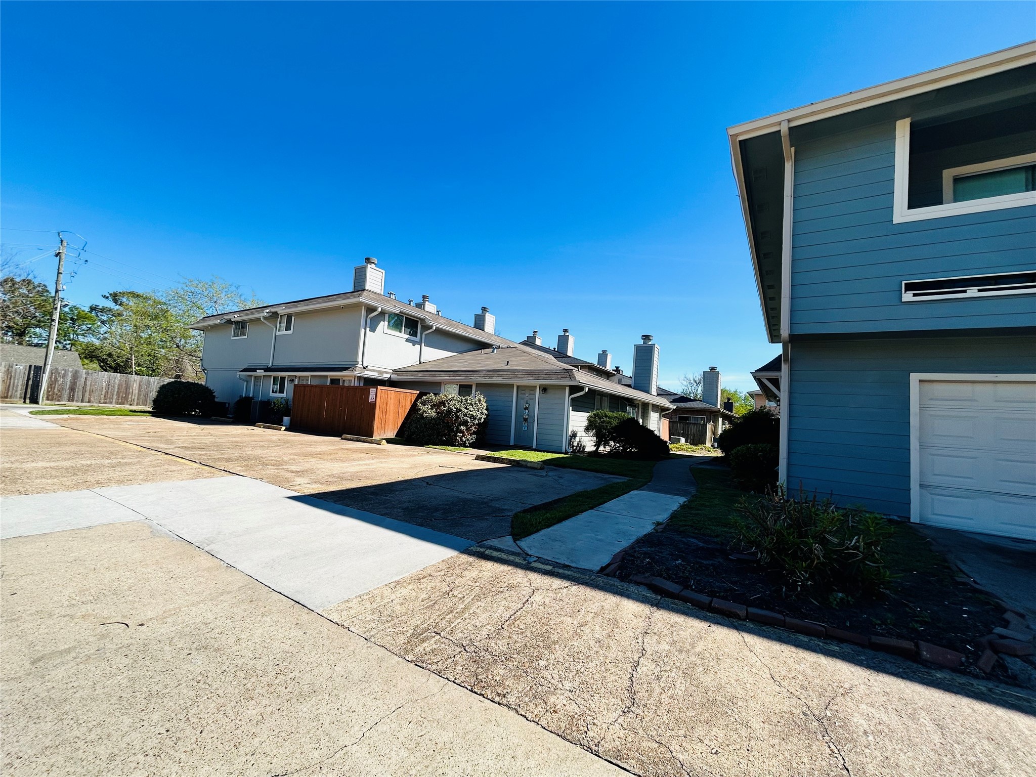 8030 Sands Point Drive, Unit D Houston, TX 77036 - Photo 23 of 24 a view of a house with backyard and garden