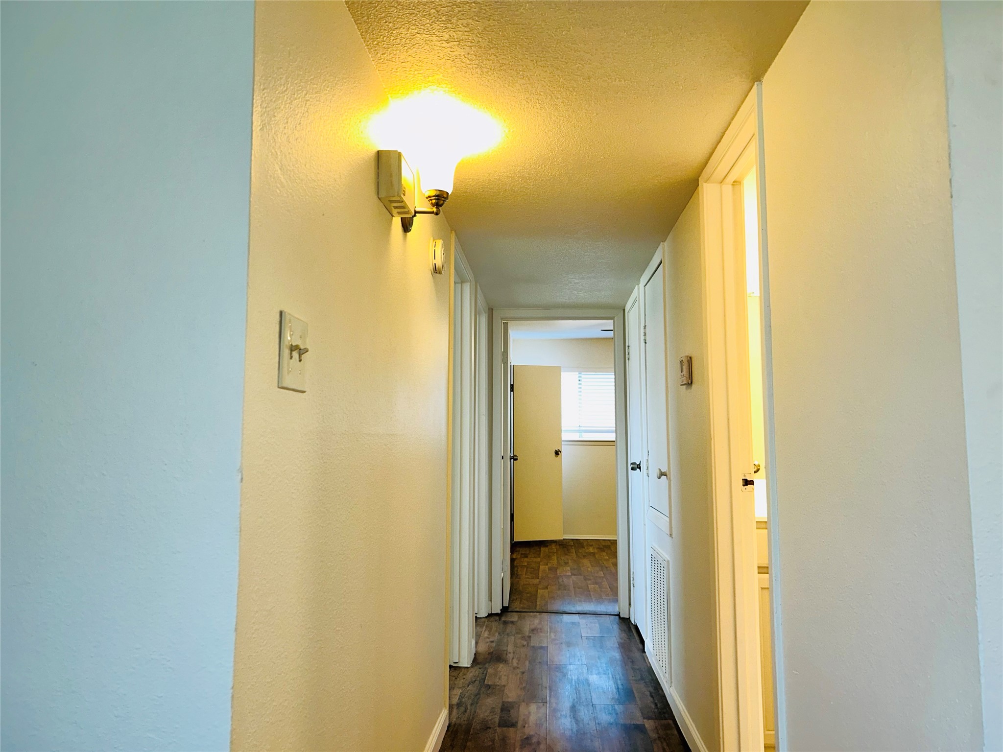 8030 Sands Point Drive, Unit D Houston, TX 77036 - Photo 6 of 24 a view of a bathroom from a hallway