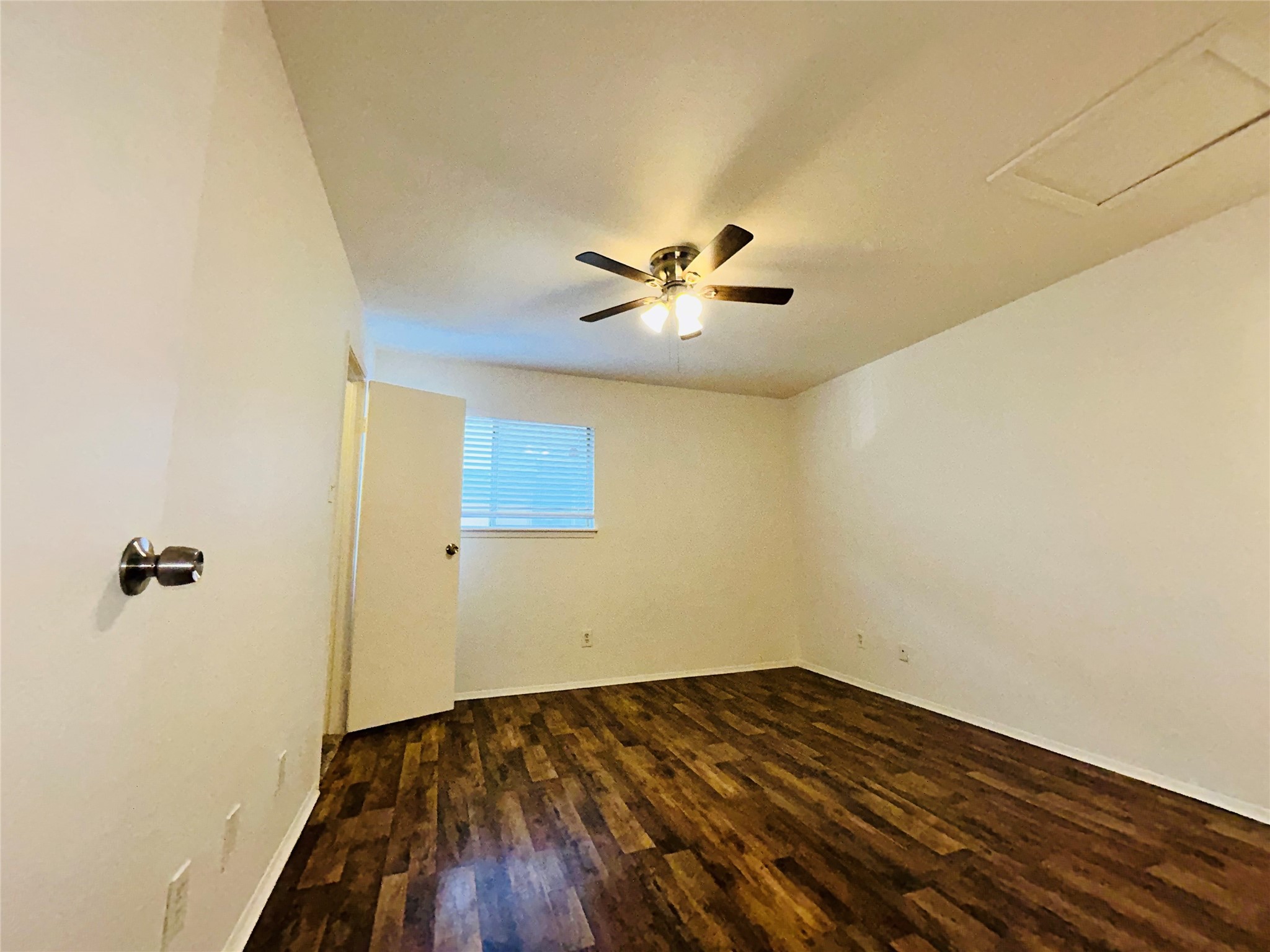 8030 Sands Point Drive, Unit D Houston, TX 77036 - Photo 9 of 24 wooden floor in an empty room