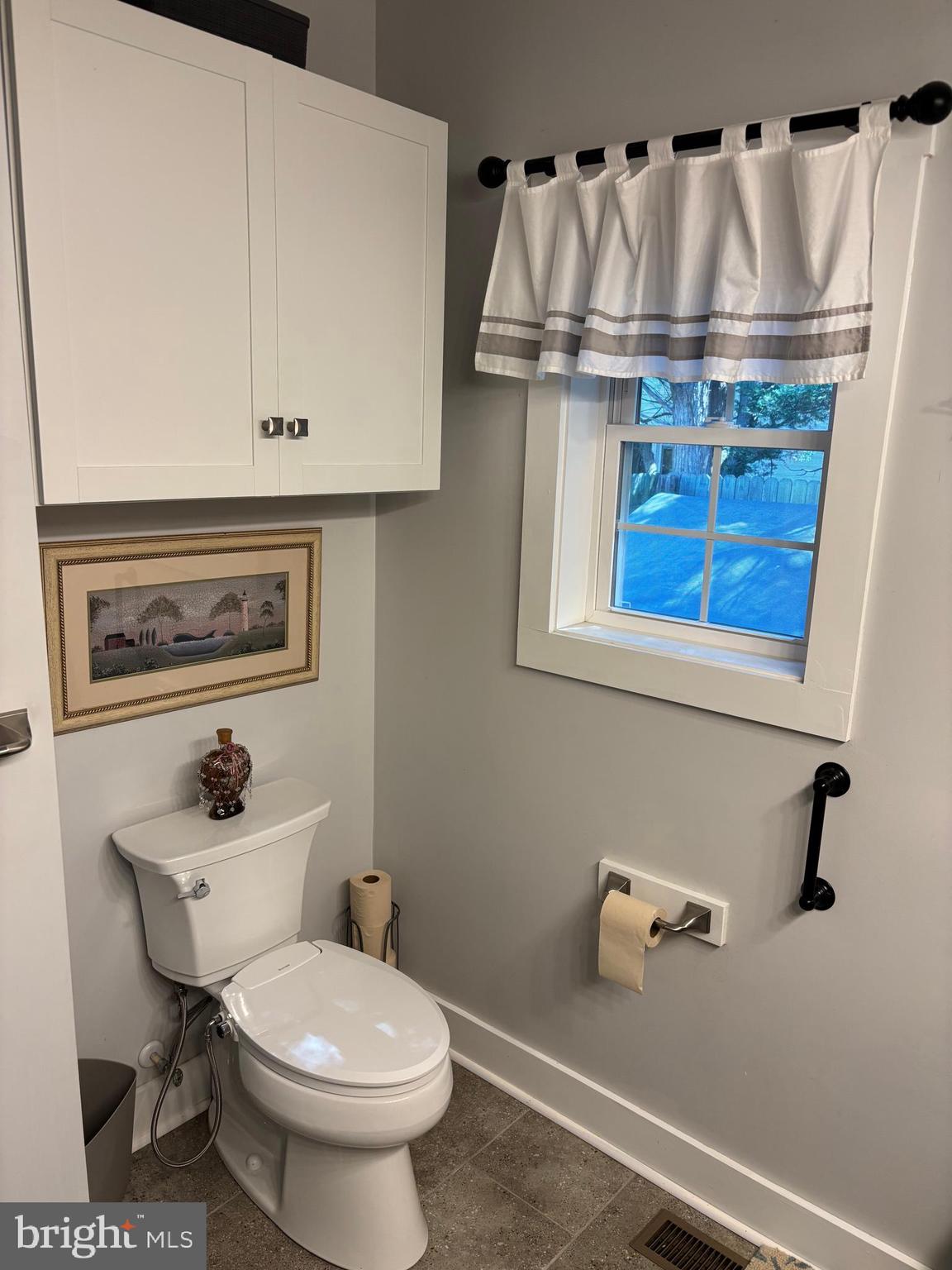 5549 Bonnie Brook Road Cambridge, MD 21613 - Photo 19 of 28 a bathroom with a sink a mirror and a toilet