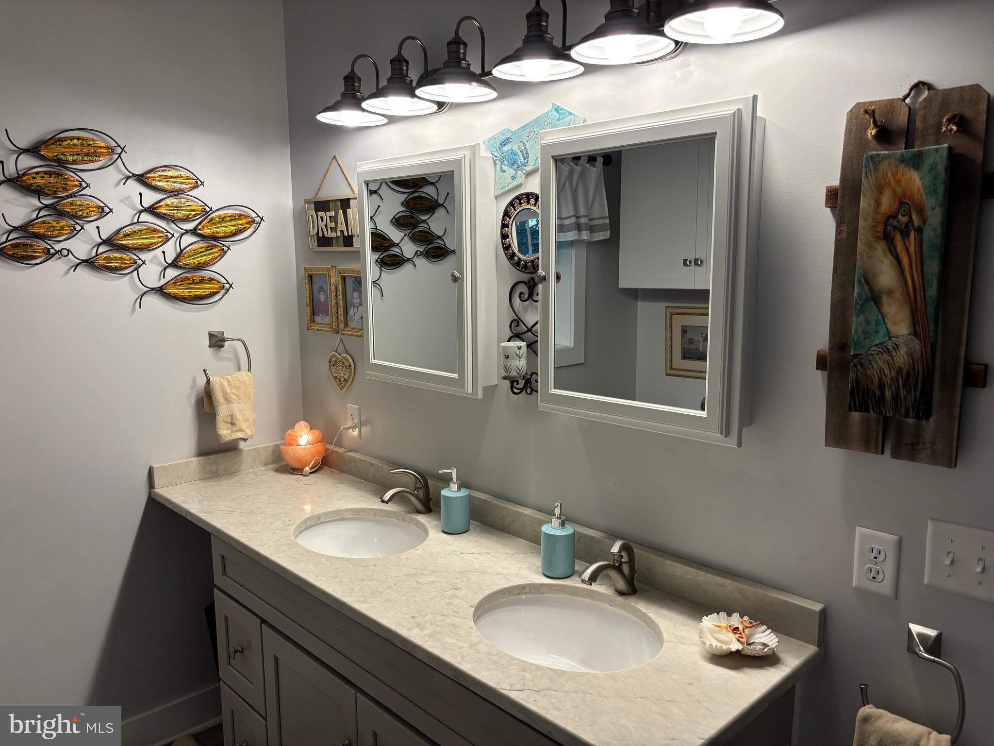 5549 Bonnie Brook Road Cambridge, MD 21613 - Photo 20 of 28 a bathroom with a sink and a mirror