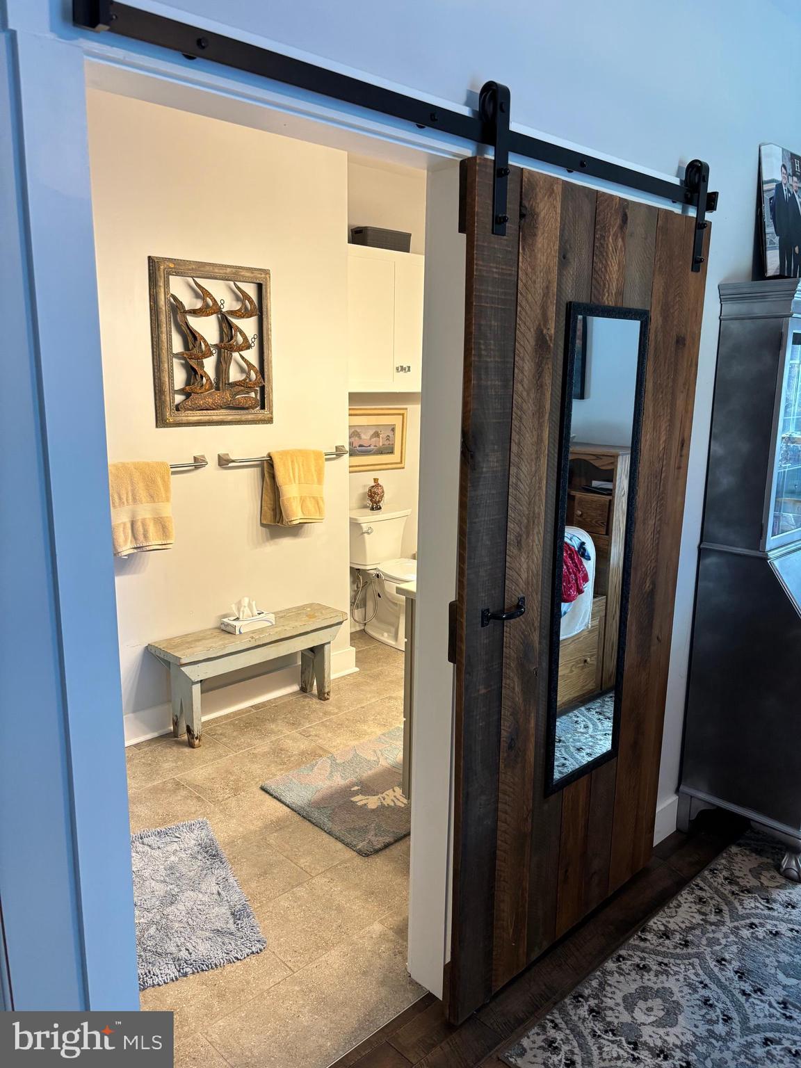 5549 Bonnie Brook Road Cambridge, MD 21613 - Photo 21 of 28 a bathroom with a sink and a mirror