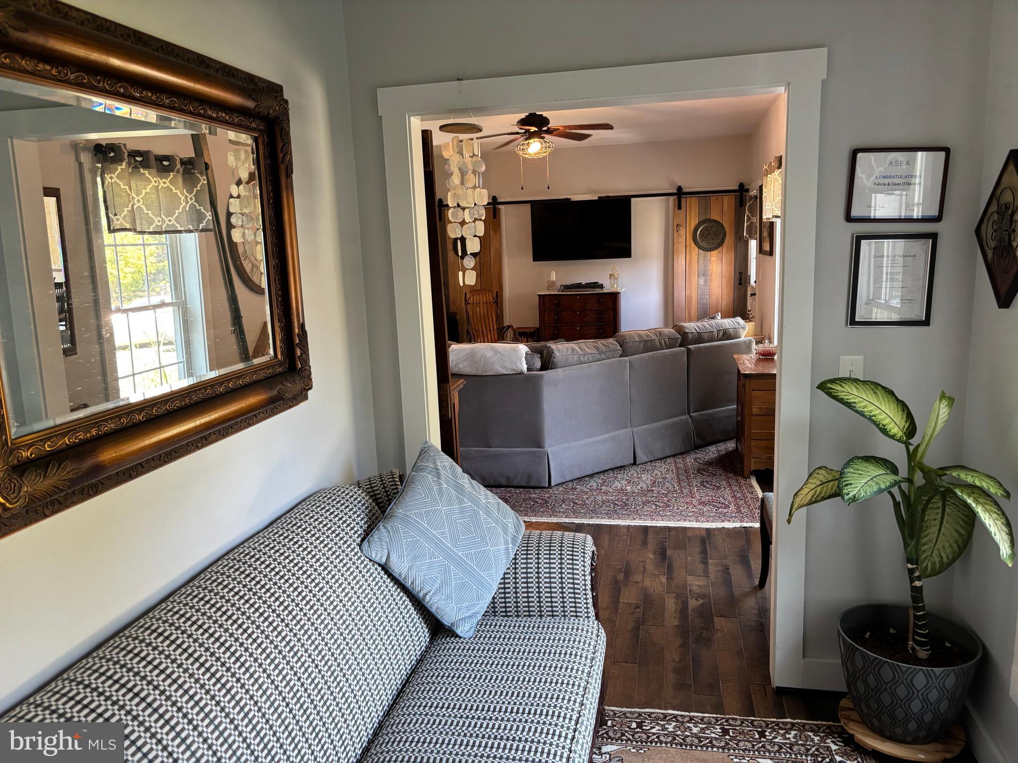 5549 Bonnie Brook Road Cambridge, MD 21613 - Photo 26 of 28 a living room with furniture and a potted plant