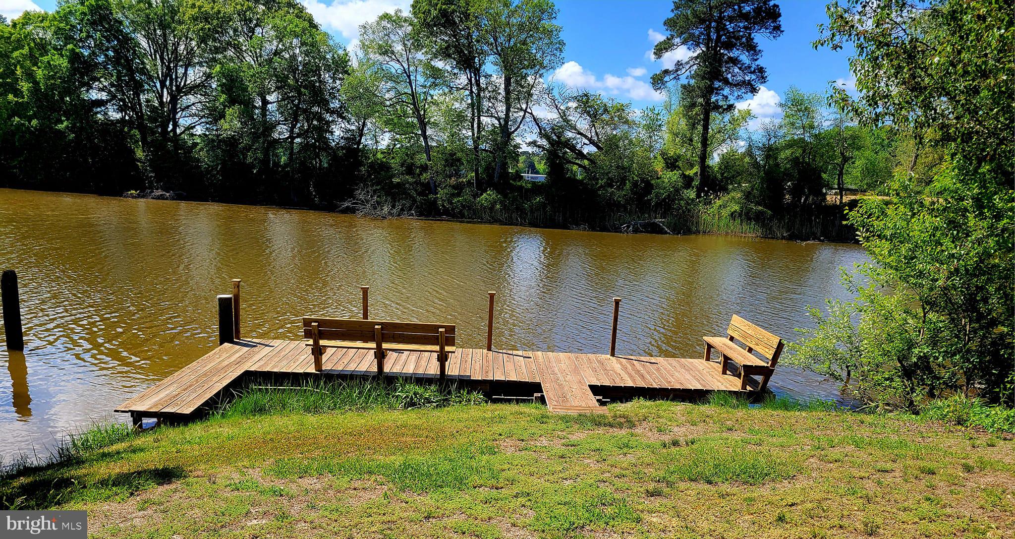 5549 Bonnie Brook Road Cambridge, MD 21613 - Photo 28 of 28 an outdoor sitting area with lake view