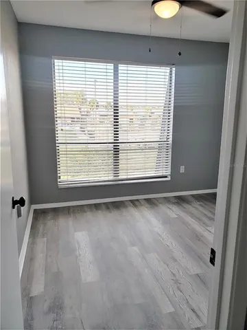 a view of an empty room with a window