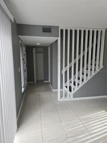 a view of a utility room with stairs
