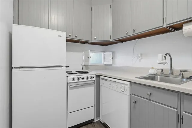 a kitchen with appliances cabinets and a sink