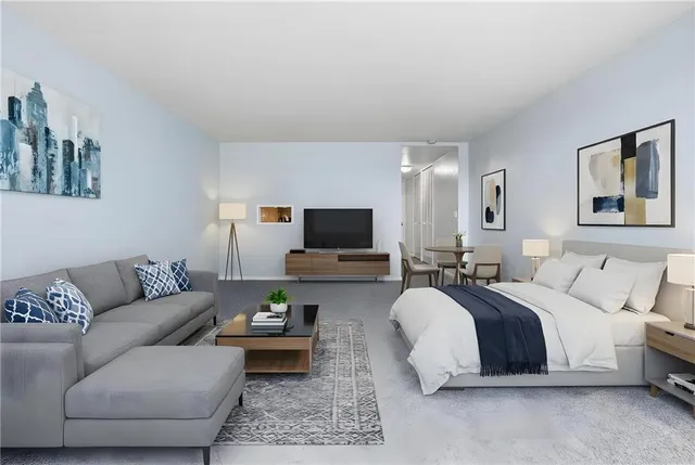 a spacious bedroom with a bed and a couch