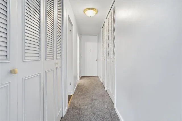 a kitchen with appliances a sink and cabinets