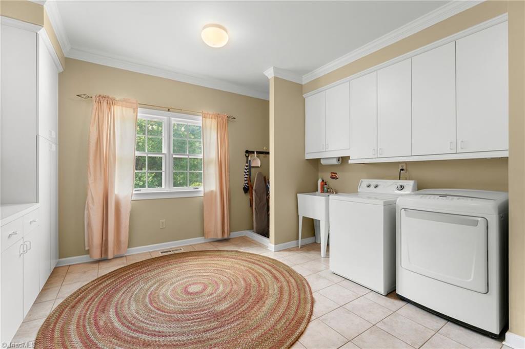 1044 Lasley Road Lewisville, NC 27023 - Photo 28 of 50 Oversized laundry room offering exceptional space, storage, and everyday convenience