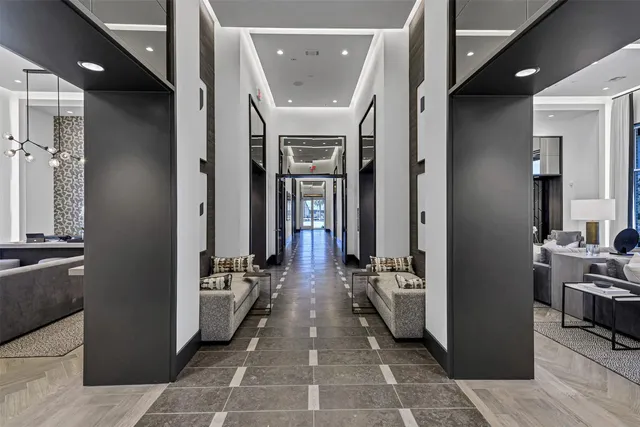 a view of a lobby with a lounge chair and outdoor space
