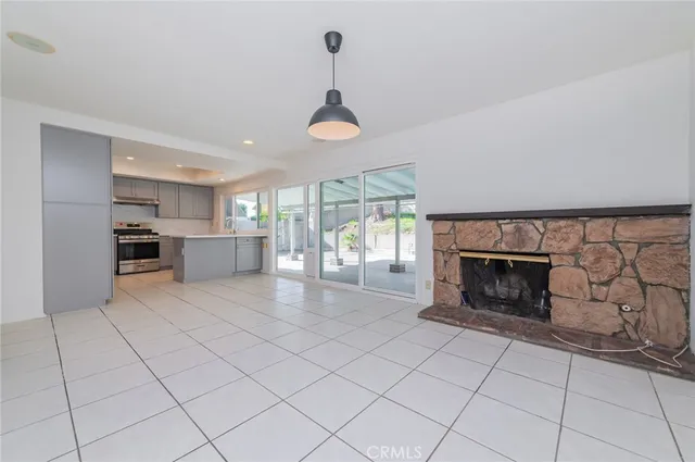 a view of a livingroom with furniture and a fireplace