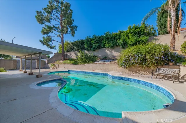 a view of a swimming pool with a patio