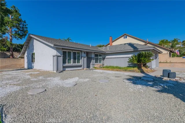 a view of house with outdoor space and balcony
