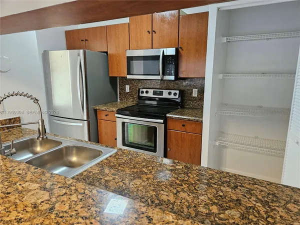 an empty room with wooden floor