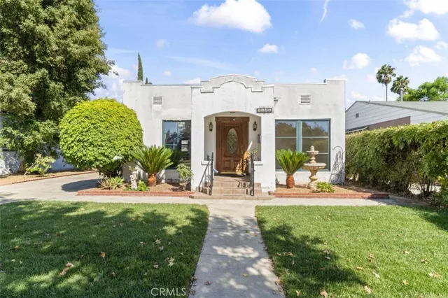 a view of a house with backyard porch and sitting area