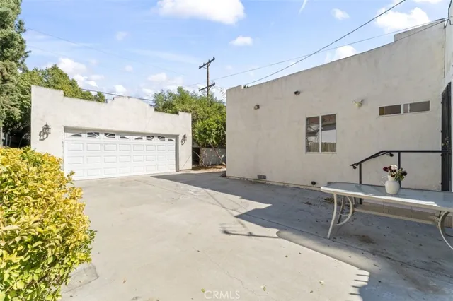 a view of a patio with a table and chairs