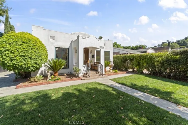 a view of a patio with table and chairs and potted plants
